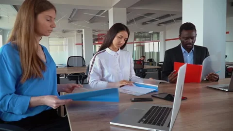 Team in start up company works with documents Stock Footage 144455732