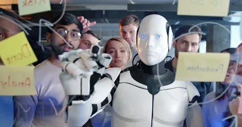Team of startup planning future tasks in office with humanoid. People and Stock Footage 180041618