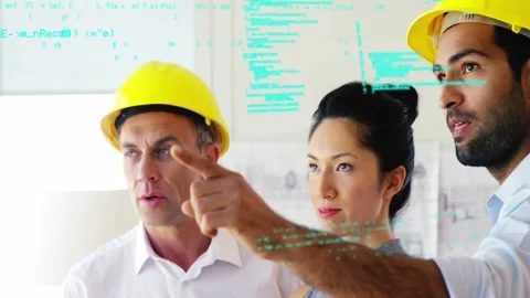 Team studying plans, right man pointing, causing teal AR overlay marking sizes Stock Footage 333445299