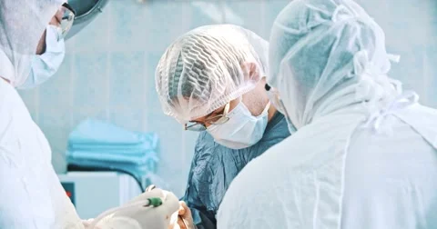 Team of surgeon in uniform perform operation Stock Footage 50670293