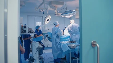 Team surgeon at work in operating room. Modern equipment in operating room. Stock-Footage 127313808