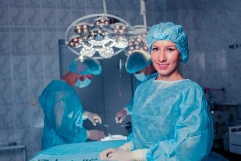 Team surgeon at work in operating room. breast augmentation Stock Photos