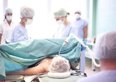 Team surgeon at work in operating room Stock Photos