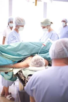 Team surgeon at work in operating room Stock Photos