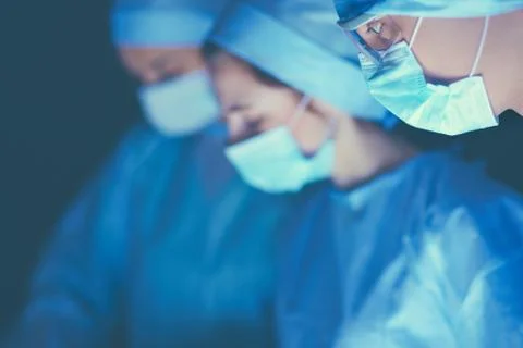 Team surgeon at work in operating room Stock Photos