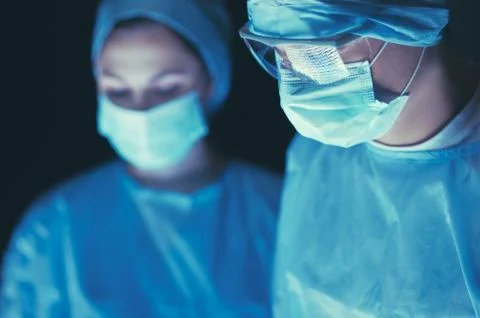 Team surgeon at work in operating room Stock Photos