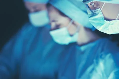 Team surgeon at work in operating room Stock Photos