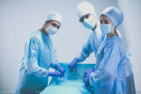 Team surgeon at work in operating room. Stock Photos
