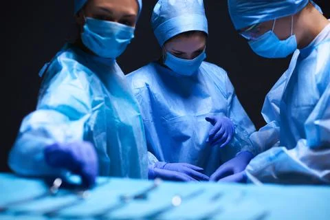 Team surgeon at work in operating room. Stock Photos