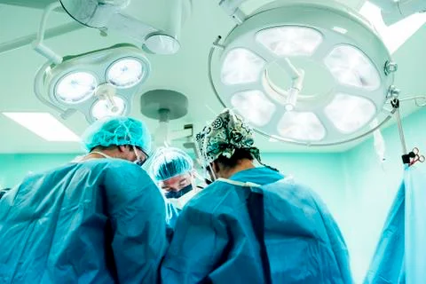 Team of Surgeons Operating. Stock Photos