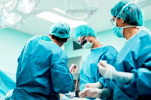 Team of Surgeons Operating. Stock Photos