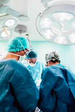 Team of Surgeons Operating. Stock Photos