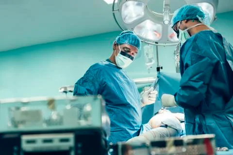 Team of Surgeons Operating. Stock Photos