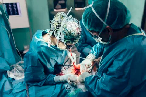 Team of Surgeons Operating. Stock Photos