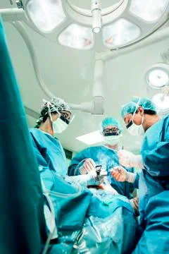 Team of Surgeons Operating. Stock Photos