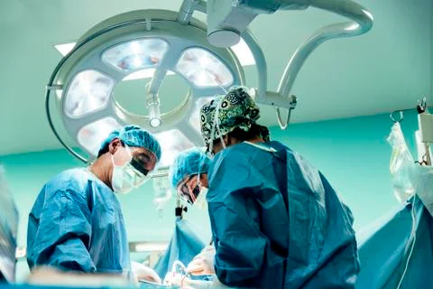 Team of Surgeons Operating. Stock Photos