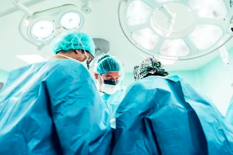 Team of Surgeons Operating. Stock Photos
