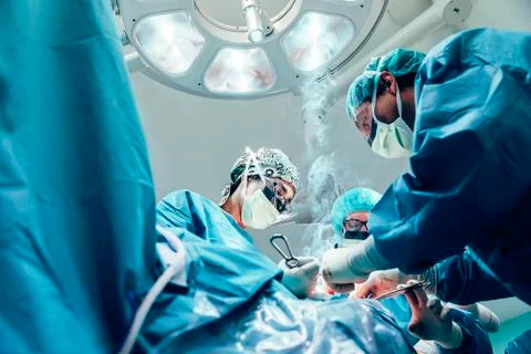 Team of Surgeons Operating. Stock Photos