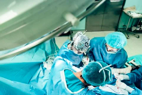 Team of Surgeons Operating. Stock Photos