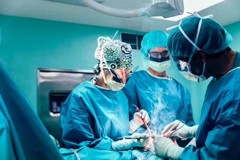 Team of Surgeons Operating. Stock Photos