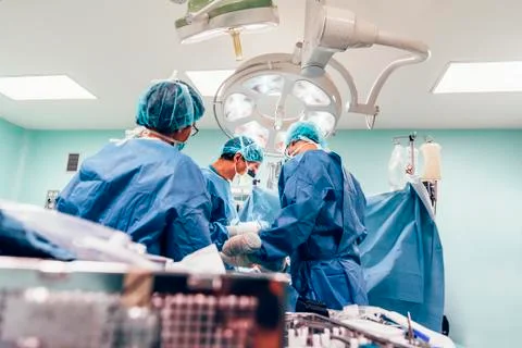 Team of Surgeons Operating. Stock Photos