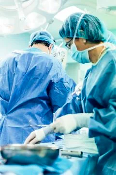 Team of Surgeons Operating. Stock Photos