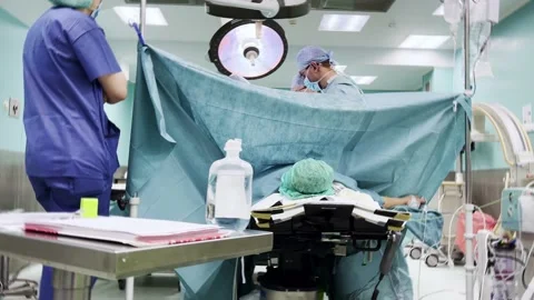 Team of surgeons in operating theater. Stock Footage 173728465