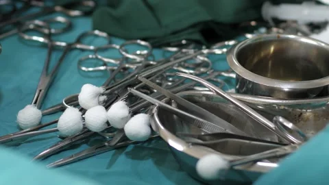 Team of surgeons in operating theater performing operation on a patient . Stock Footage 156017116