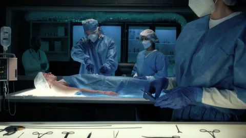Team of Surgeons Perform a Delicate Operation Using Futuristic Surgical Bed Video stock 157174680