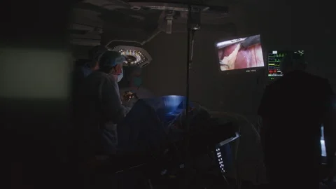 Team of surgeons perform operation with ill patient Video stock 252721819