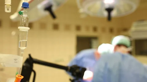 Team of surgeons performing an operation on a patient in a hospital Stock Footage 33787709