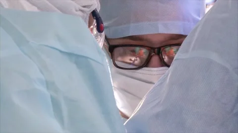 Team of surgeons in uniform doing surgery operation Stock Footage 61406228