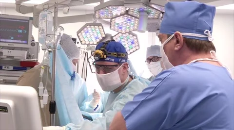 Team of surgeons in uniform doing surgery operation Stock Footage 61406256