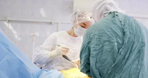 A team of surgeons at work. Closeup of operation. Medicine, surgery, health care Stock Footage 121095518