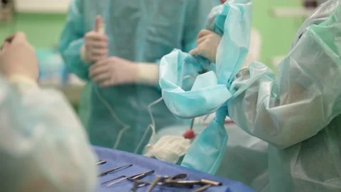 A team of surgeons at work in the operating room. Modern equipment in the Video stock 179311445