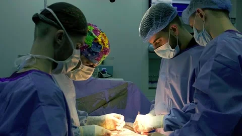 A team of surgeons at work in the operating room. Stock Footage 270466257