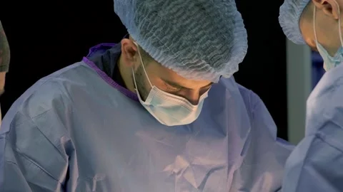 A team of surgeons at work in the operating room. Stock Footage 270467524