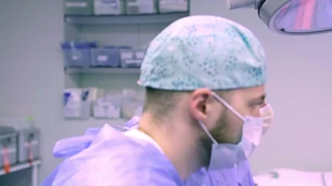 A team of surgeons at work in the operating room Stock Footage 270554248