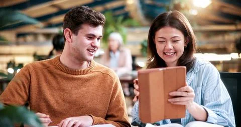 Team, tablet and creative feedback with document for update, report and int.. Stock Photos