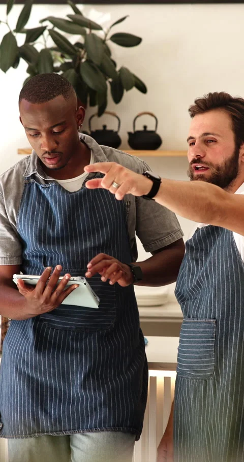 Team, tablet and waiter training in cafe for table management, explain Stock Footage 338221559