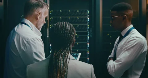 Team, tablet coding and server room for planning, digital screen programming or Stock Footage 262206461