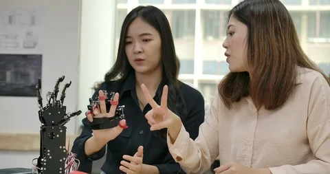 Team of talented engineers testing innovative robotic technology in laboratory. Stock Footage 111824692