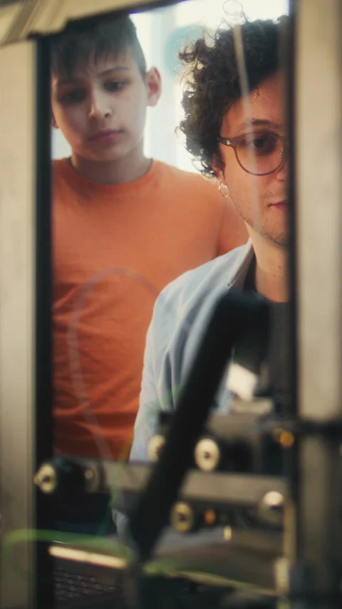 Team of Talented Kids Studying Advanced Automated 3D Printer with Teacher Stock Footage 311807985