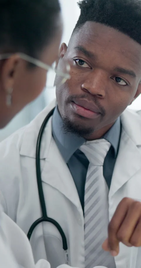 Team, talking and African doctors in hospital for consulting, advice and Stock Footage 336806243