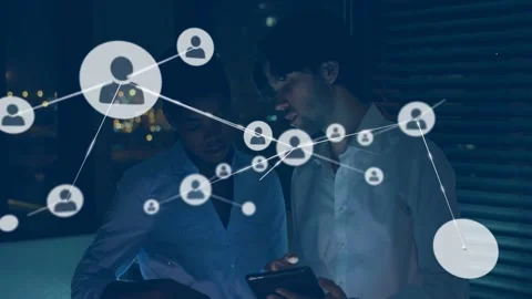 Team tapping tablet and pointing, activating overlay expanding node into web for Stock Footage 332591840