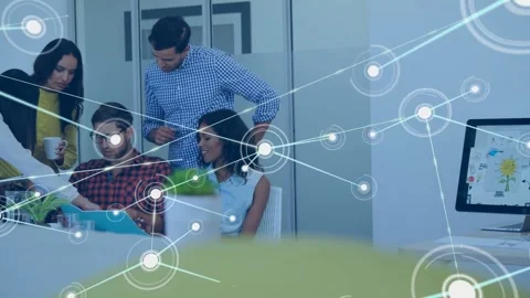 Team tapping tablet and reviewing design mockup while animated network nodes Stock Footage 334036769