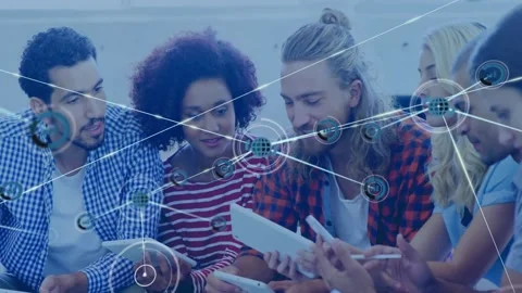 Team tapping tablet for review, tech network expanding from single node into web Stock Footage 333962528