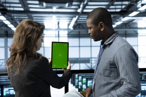Team of technician in data center using green screen mockup tablet, 스톡 사진