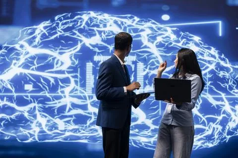 Team of technicians brainstorming ways to develop AI 写真素材