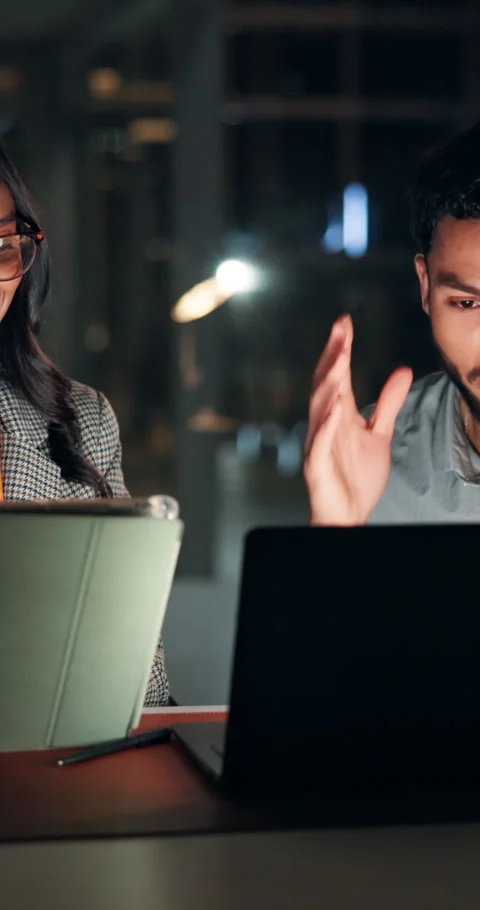 Team, technology and meeting at night in office for project, review or deadline Stock Footage 322126840